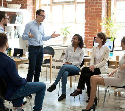 Transaction Advisors' Business Coach Holding a Meeting To Consult With a Company